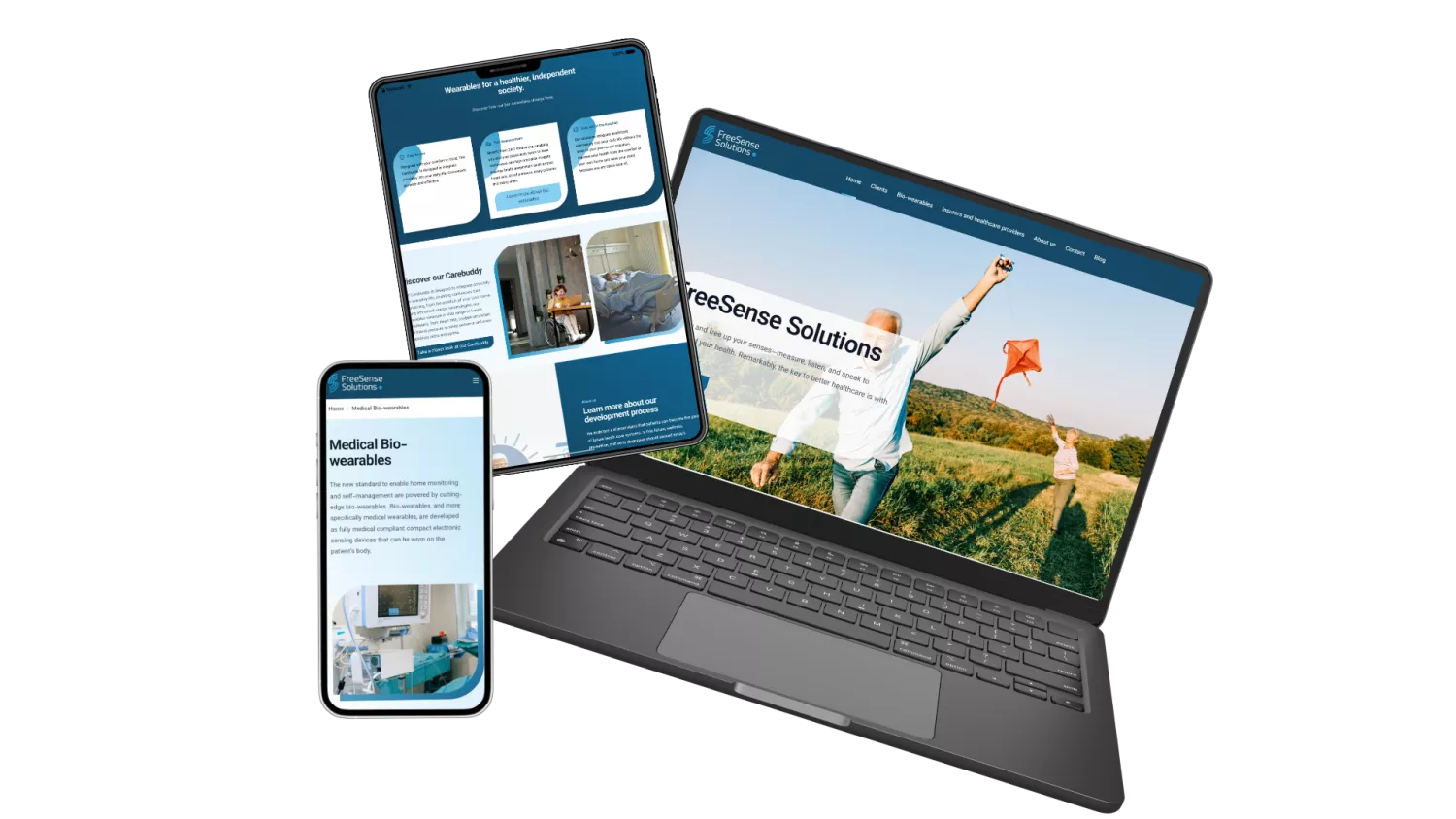 Laptop, tablet en smartphone tonen de website van FreeSense Solutions over medische bio-wearables.